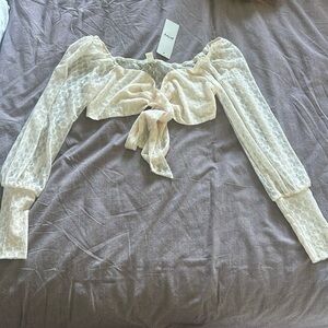 Brand new tie in the front cream top